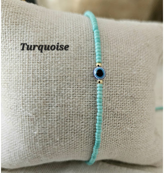 Bracelet en Turquoise et Œil porte bonheur .