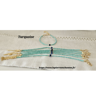 Bracelet en Turquoise et Œil porte bonheur .